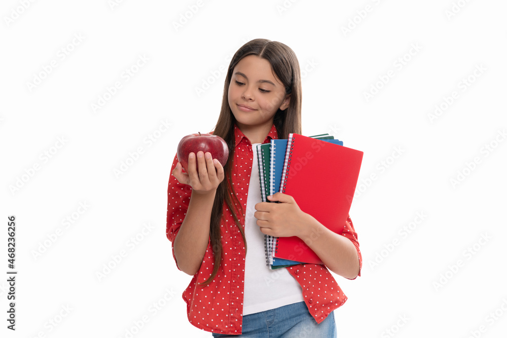 smiling teen girl hold school copybook for studying and apple lunch isolated on white, schoolgirl smiling teen girl hold school copybook for studying and apple lunch isolated on white, schoolgirl