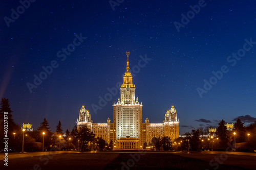 Photography The main building of Moscow State University in the late evening against the background of a dark blue starry sky