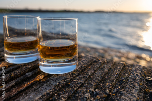 Drinking single malt Scotch whisky at sunset with sea, ocean or river view, private whisky tours in Scotland, UK