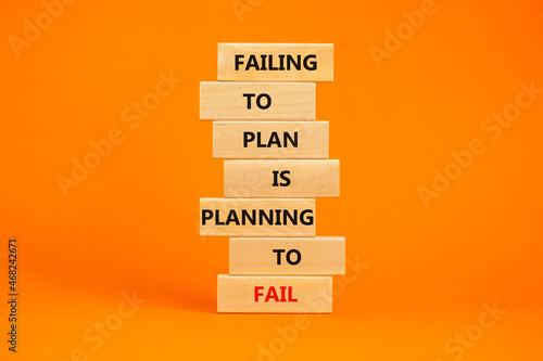 Failing to plan or planning fail symbol. Wooden blocks with words Failing to plan is planning to fail. Beautiful orange background, copy space. Business, failing to plan planning fail concept. photo