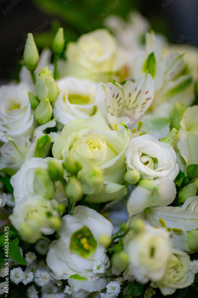 Fototapeta premium Green white decorated rose flower heads and petals on wedding bouquet