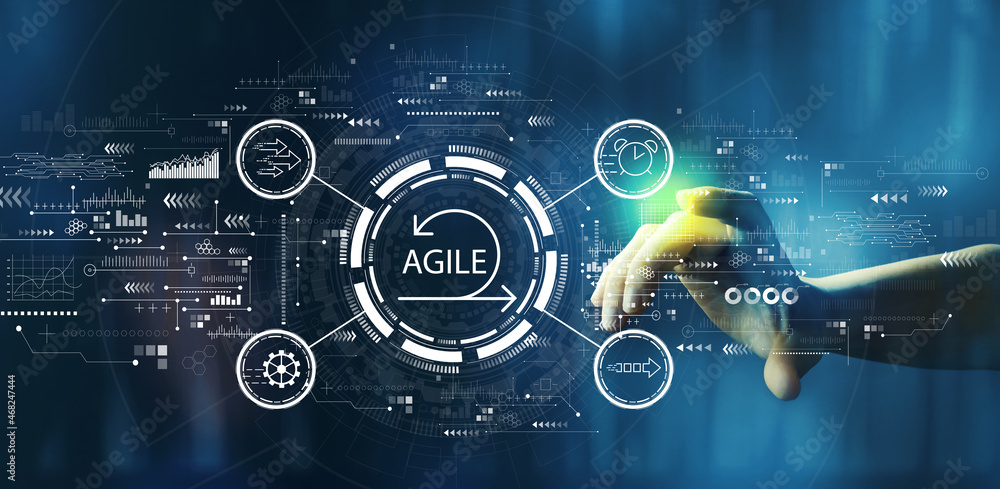 Agile concept with hand pressing a button on a technology screen