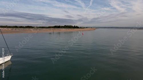 Aerial view of small vessels yachts sail in front of Hayling Beach off the coast of Southsea on a sunny morning. Bracklesham Bay.  photo