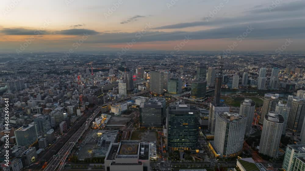 Time lapse of sunrise over busy highway ramp in the morning rush hour in Tokyo, Japan Time lapse of sunrise over busy highway ramp in the morning rush hour in Tokyo, Japan