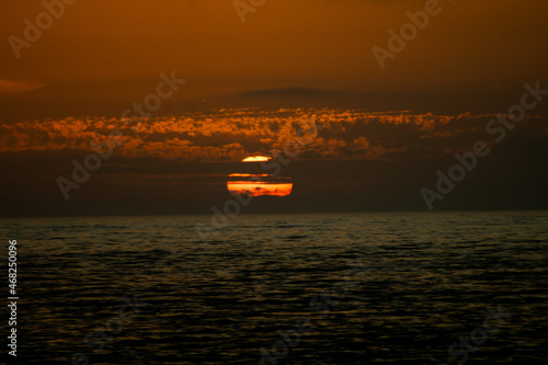 sunset over the sea cloudy
