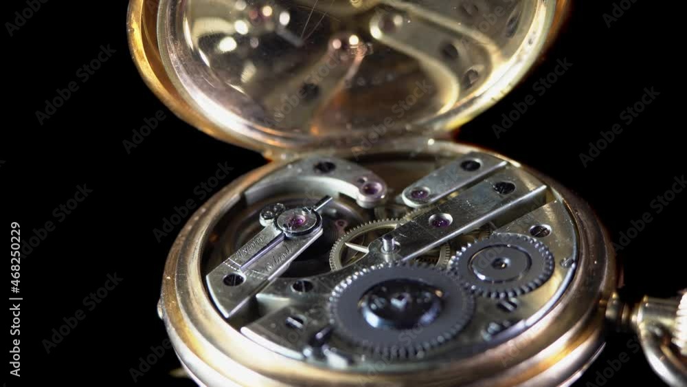 The work of the mechanism of an old pocket gold watch The work of the mechanism of an old pocket gold watch