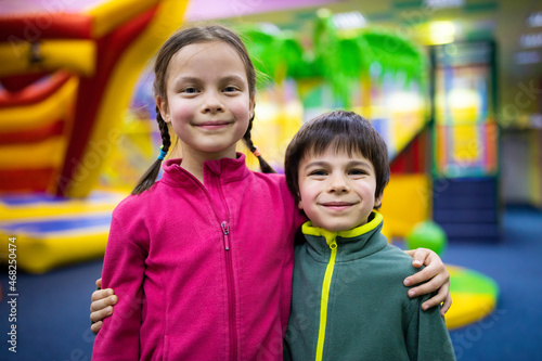 Portrait of smiling children in amusement center for kids