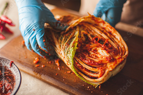 The process of making traditional Korean kimchi from napa cabbage photo