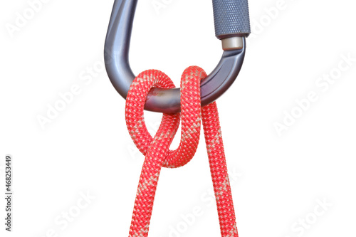 Obraz na płótnie Munter hitch tied with red rope on carabiner, isolated on white background. This adjustable knot used in climbing is also called the Italian hitch, Mezzo Barcaiolo or the Crossing hitch. w salonie