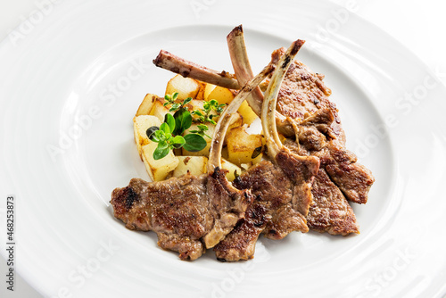 Plate with lamb ribs and potatoes