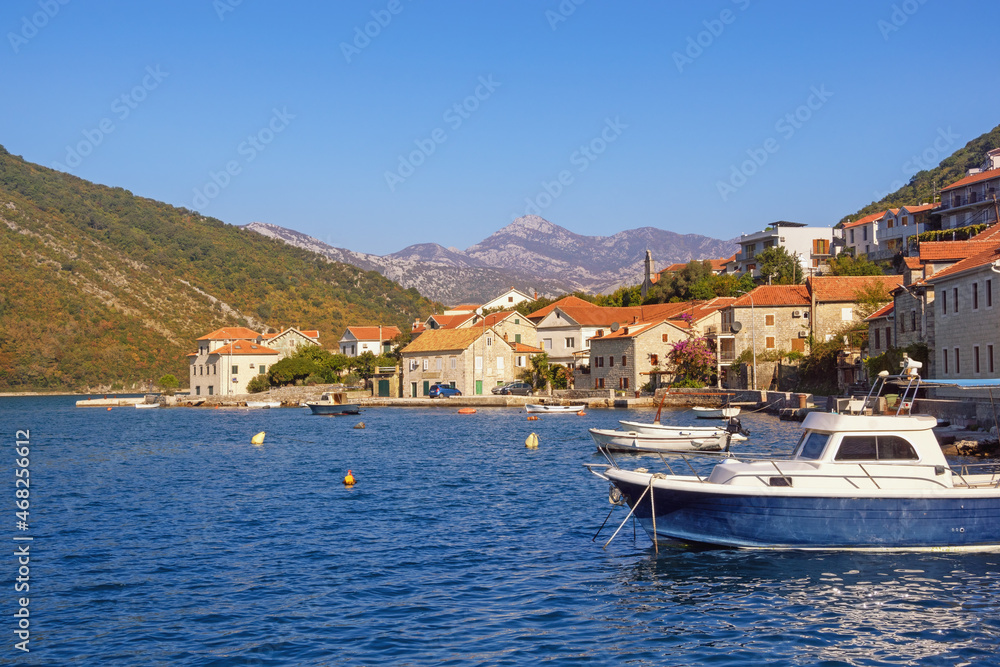 Beautiful autumn Mediterranean landscape. Seaside village on cost of bay.  Montenegro, Adriatic Sea. View of Kotor Bay and Lepetane village (Tivat)