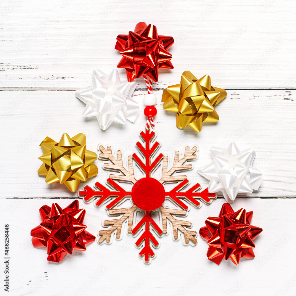 Creative composition made of Christmas decoration as tree on White wooden background with copy space. Top view, flat lay. New Year minimal concept. Creative composition made of Christmas decoration as tree on White wooden background with copy space. Top view, flat lay. New Year minimal concept.