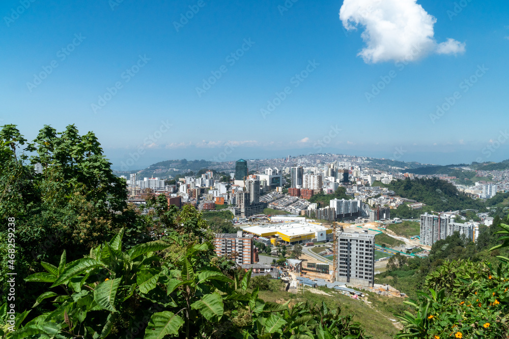 Panoramic and urban landscape of the city of Manizales and blue sky. Manizales, Caldas, Colombia.