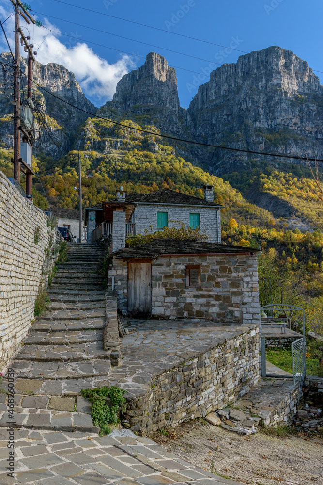 Traditional architecture during fall season in the picturesque village of Mikro papigo in Epirus zagori greece Traditional architecture during fall season in the picturesque village of Mikro papigo in Epirus zagori greece