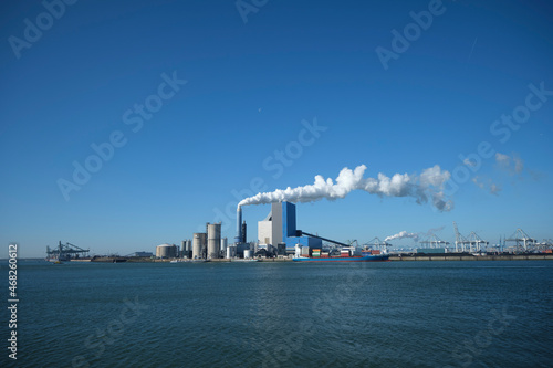 ROTTERDAM, THE NETHERLANDS The Uniper coal power plant in full operation with smoking chimneys at the Maasvlakte near Rotterdam in the Netherlands. photo