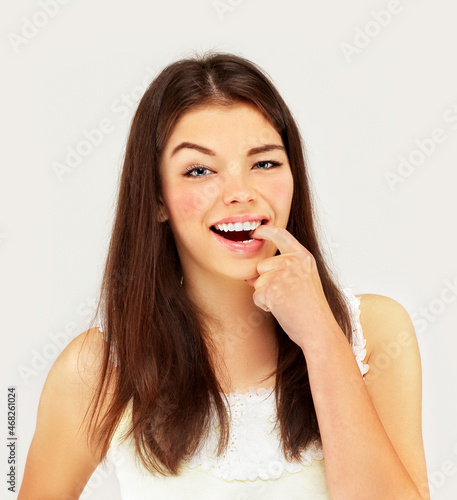 Winner.Portrait of laughing girl gesturing.
