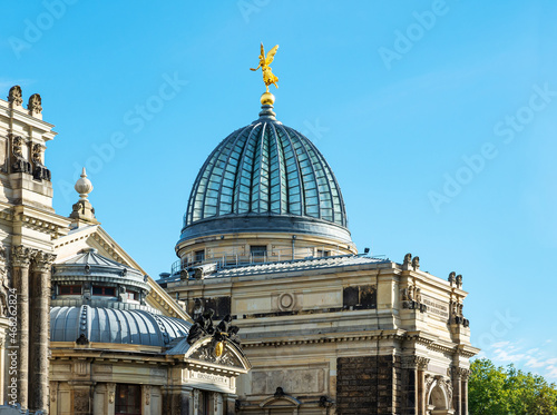 The glass cupola, called lemon squeezer, of the building of the Academy of Fine Arts, Dresden, Germany. On the top of the dome a golden angel. photo