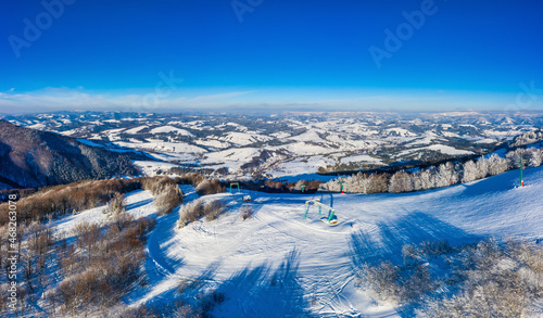 Aerial view of beautiful winter mountain slopes