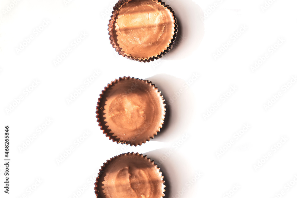 Peanut butter filled candy with chocolate frosting isolated on white background Peanut butter filled candy with chocolate frosting isolated on white background