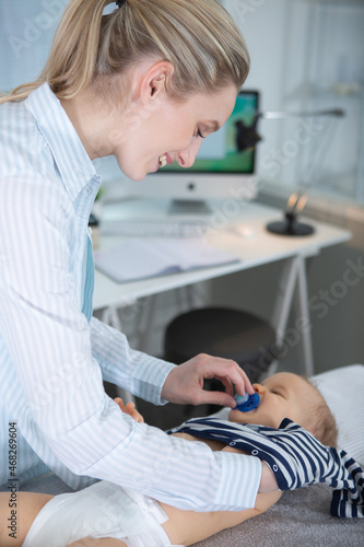 baby in doctor for medical checkup
