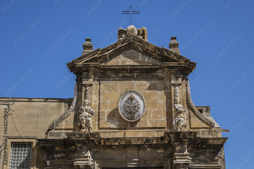 Baroque portal of Roman Catholic Basilica of Most Holy Trinity (Basilica della Santissima Trinita, or Basilica La Magione, completed in 1191) - Norman church of Palermo. Sicily, Italy.