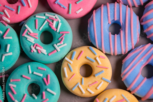 Donats from sugar paste. Multi-colored sugar art cakes. Different types of colorful Donats decorated sprinkles and icing. Cake art concept image photo