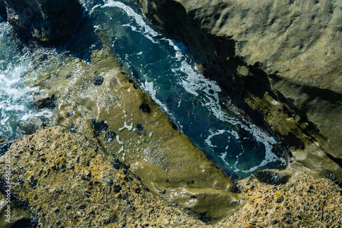 stone ground near the pacific ocean with water