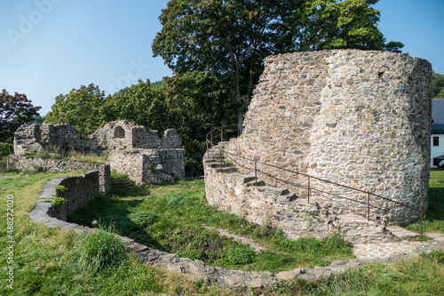 ruin of a medieval castle in the middle of woods in czech republic photo