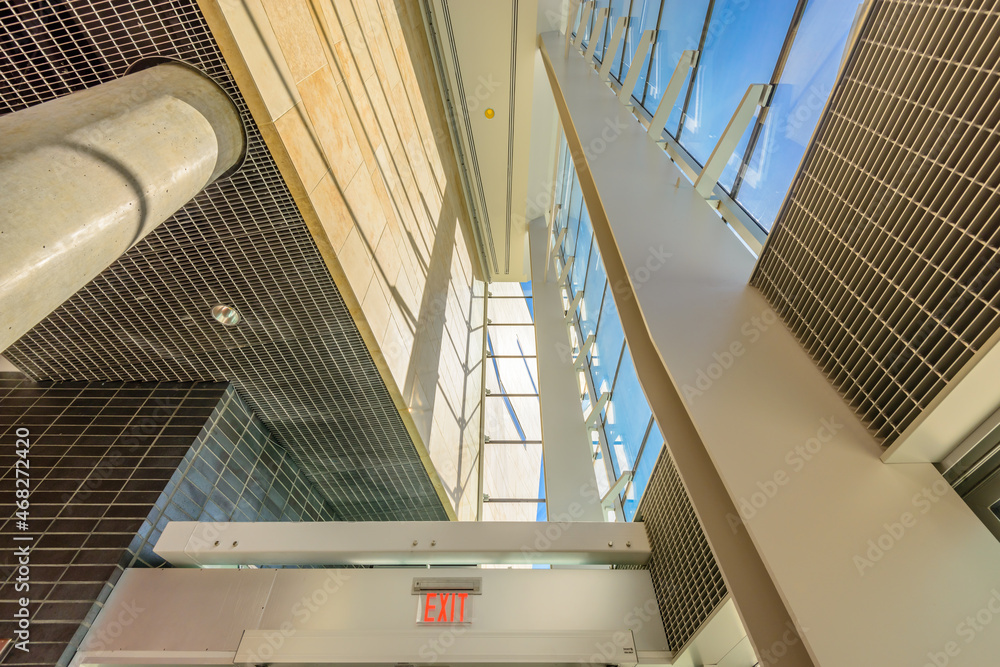 Obraz premium Abstract fragment of the architecture of modern lobby, hallway of the luxury hotel, shopping mall, business center in Vancouver, Canada. Interior design.