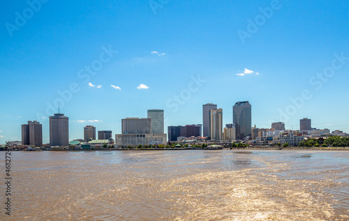New Orleans city panorama from Mississippi River with business district skyscrappers and river promenade, Louisiana, USA photo