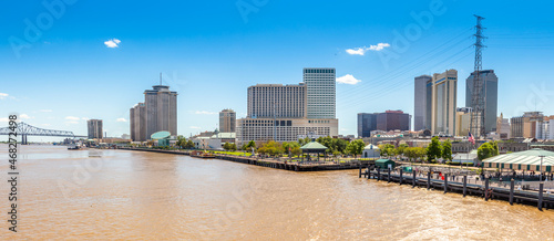 New Orleans city panorama from Mississippi River with business district skyscrappers and river promenade, Louisiana, USA photo