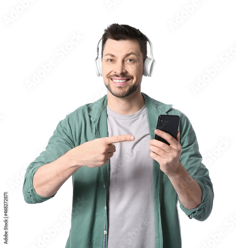 Man with phone and headphon...