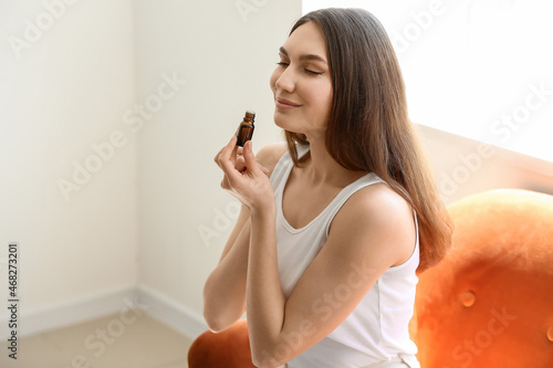 Young woman smelling natura...