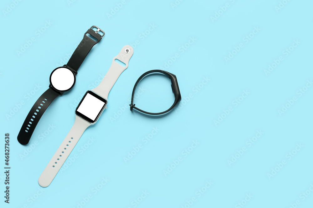 Different smart watches on color background Different smart watches on color background