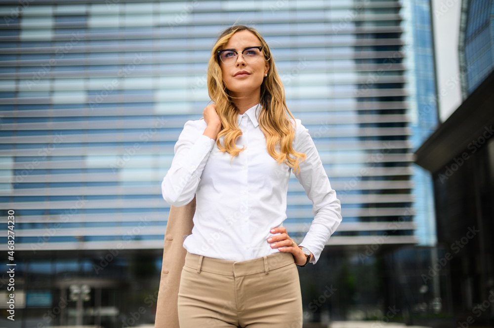 Confident young female manager outdoor in a modern urban setting Confident young female manager outdoor in a modern urban setting