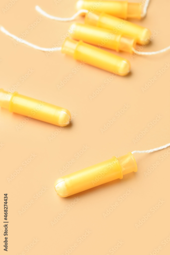 Menstrual tampons on yellow background Menstrual tampons on yellow background