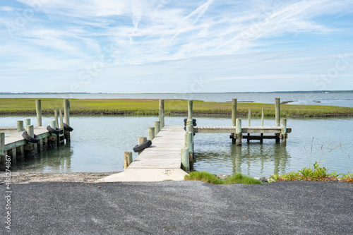 Free publish fishing location on paved boat ramp kayak canoe paddle launch on river delta marshland swamp, shallow fresh and brackish water for recreation and outdoor activities photo