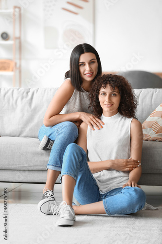 Beautiful sisters sitting i...