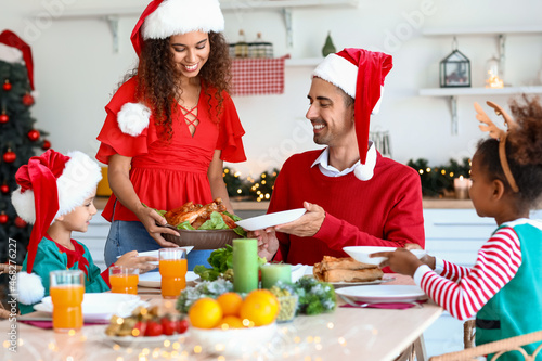 Happy family having Christm...