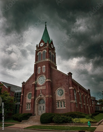 Slovenian Church amidst dramatic dark clouds Indianapolis, Indiana, USA