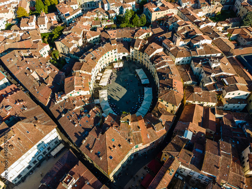 Aerial view of Piazza dell'Anfiteatro, a medieval square with cafè and market in Lucca old town, Tuscany, Italy.