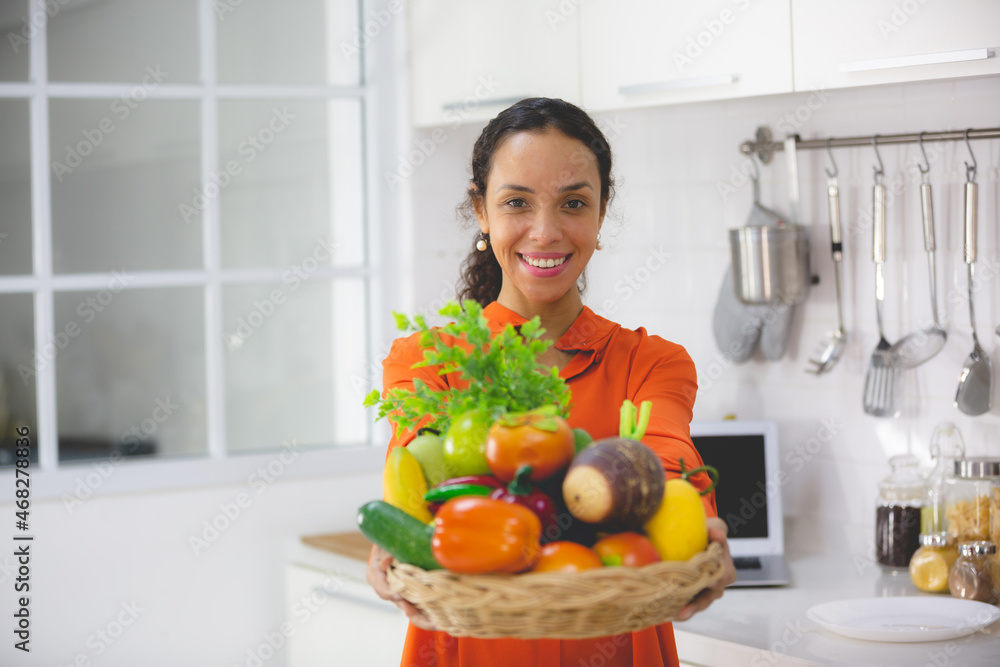 African American woman having fun and enjoy happy with a food in kitchen at home
