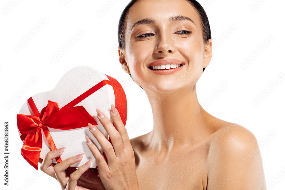 Happy beautiful young woman holding red gift box on isolated white background Happy beautiful young woman holding red gift box on isolated white background