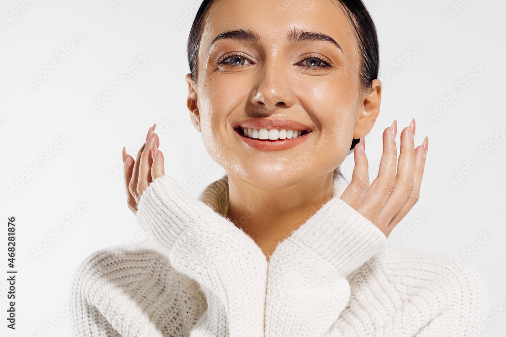 smiling woman , enjoying beauty treatments, beautiful laughing girl enjoying touching her face, on white background smiling woman , enjoying beauty treatments, beautiful laughing girl enjoying touching her face, on white background