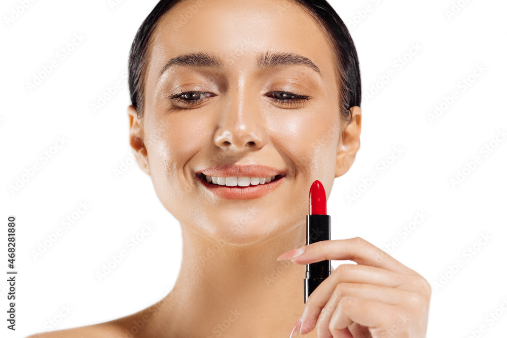 Beautiful woman with lipstick, photo of a brunette with red lipstick on a white background, woman applying lipstick Beautiful woman with lipstick, photo of a brunette with red lipstick on a white background, woman applying lipstick