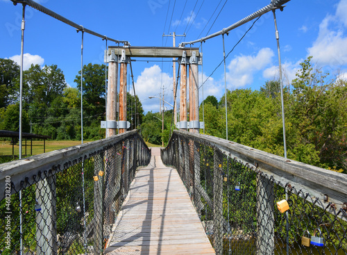 The historic swinging bridge spans the Madawaska River in Renfrew, Ontario photo