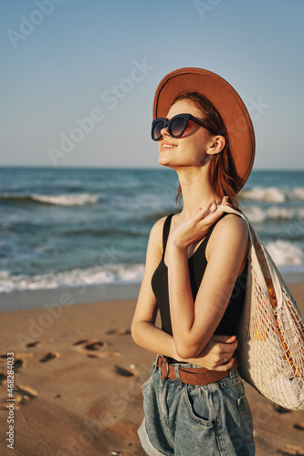 woman walking on the beach landscape sun fun lifestyle