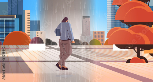 unhappy woman walking outdoor under rain feeling desperate mental health diseases unemployment depression