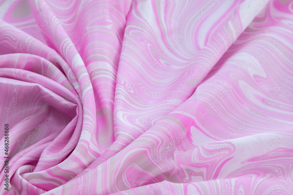 Fototapeta premium pink top view of base color silk, fabric with pink marble pattern silk, wavy, spiral, crease, swirl, backdrop, cloth background, have copy space for text