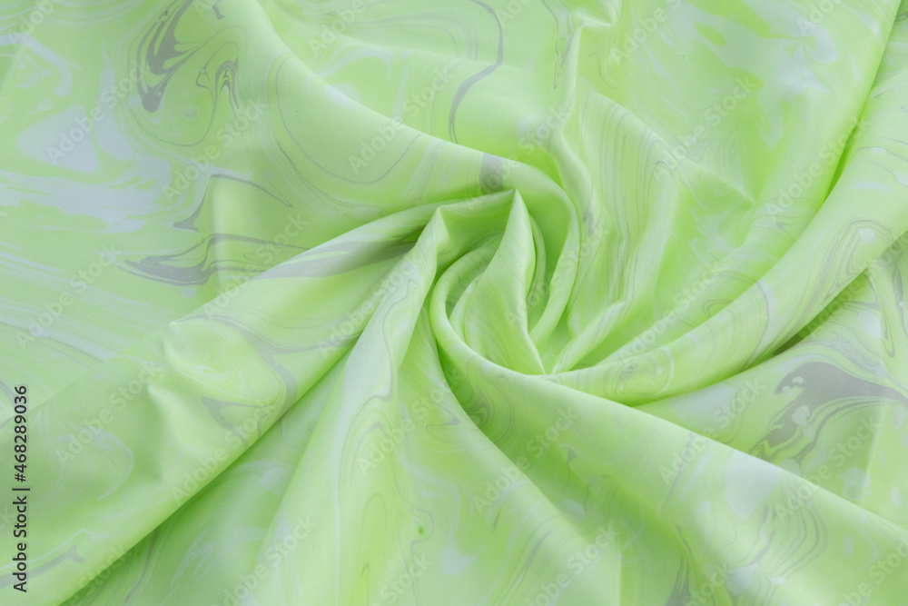 Green top view of base color silk, fabric with green marble pattern silk, wavy, spiral, crease, swirl, backdrop, cloth background, have copy space for text Green top view of base color silk, fabric with green marble pattern silk, wavy, spiral, crease, swirl, backdrop, cloth background, have copy space for text